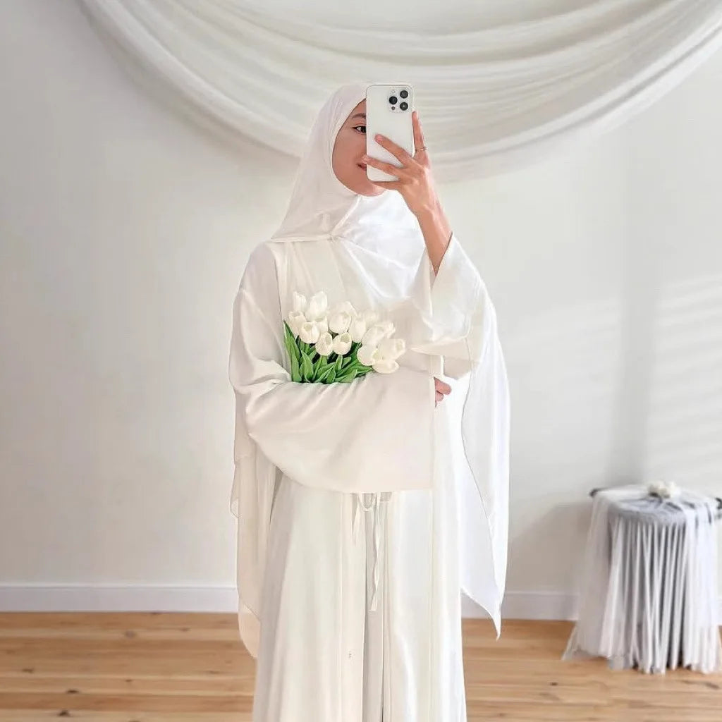two-piece cardigan jacket and a sleeveless inner dress